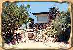 This charmer sits on its own part of the property, with its own road. This is the formal front entrance, from the private parking area.